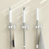 Suporte de Mops e Vassouras Modern Lar™ / Fixação Forte e Organização Perfeita sem Furos + Gancho Extra para Utensílios!