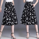 [COMPRE 1 E LEVE 2] Calça-Saia Olivia™ Midi Floral com Cintura Alta / Toque de Feminilidade e Frescor que Valoriza Você em Qualquer Ocasião!